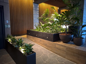 The lush green infrastructure at 1 Hotel & Homes at Seafarers. designed by Fytogreen, showcases sustainable urban landscaping with nearly 5,000 plants, green walls, and rooftop biodiversity in the heart of Melbourne.