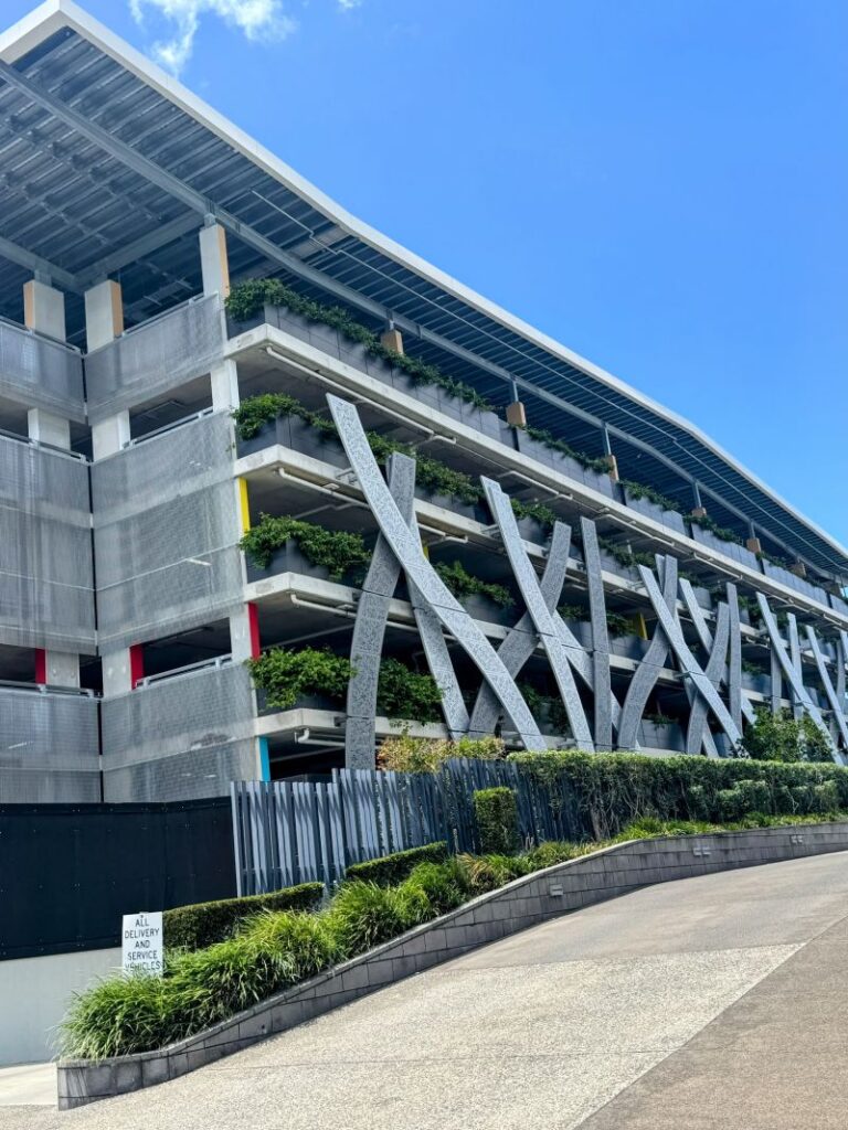 Custom-engineered balustrade planters delivering resilient greening for Brisbane Airport’s new multi‑level car park.