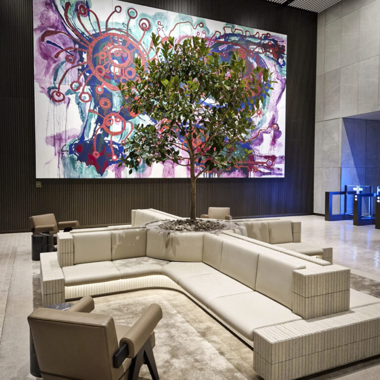 GRC water reservoir planters by Fytogren with lush Ficus trees creating a vibrant, green oasis in the outdoor plaza of Festival Tower Two.